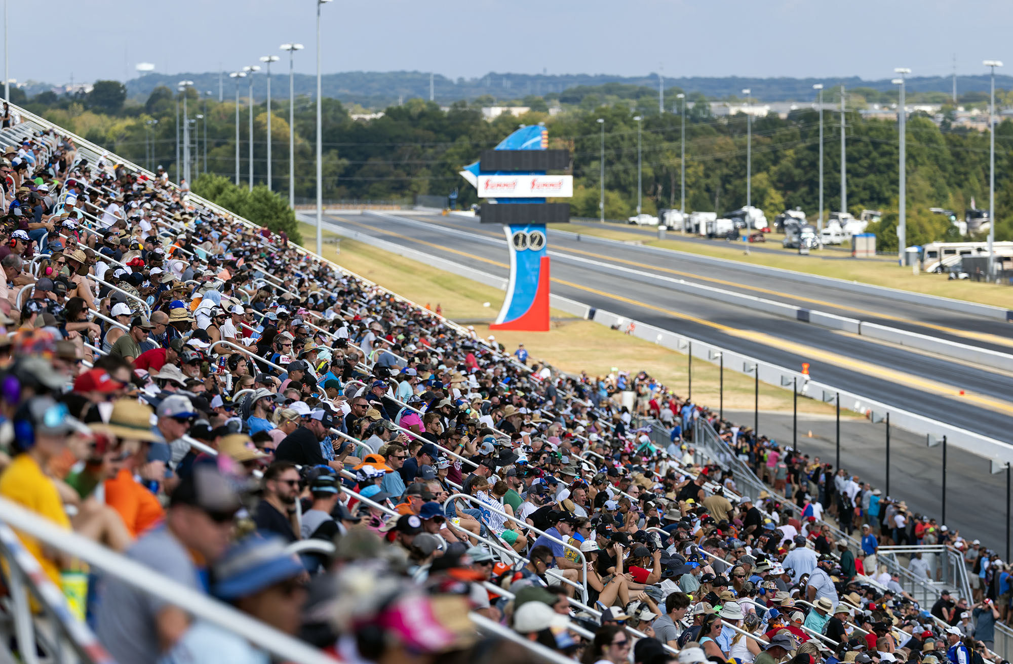 A full grandstand above the staging lanes on race day