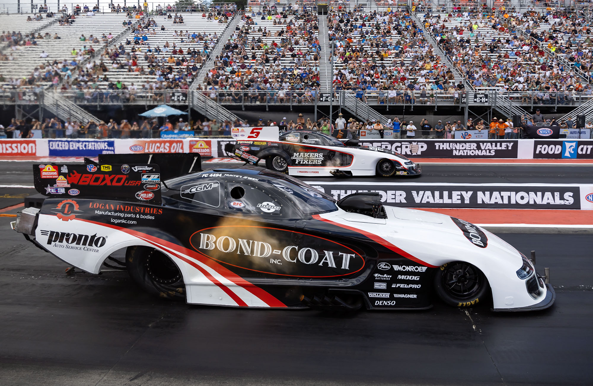 Hunter Green races door-to-door at the Thunder Valley Nationals in the Bond-Coat Funny Car