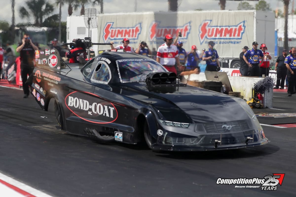 Chad Green's Bond-Coat Ford Mustang Funny Car staged on the starting line at the Gatornationals